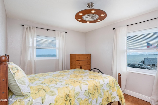 bedroom featuring baseboards