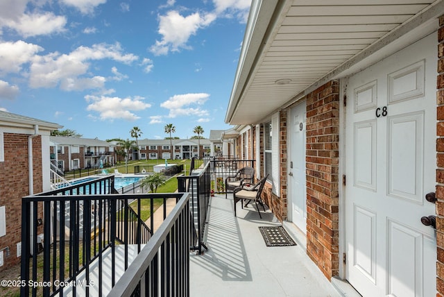 balcony featuring a residential view