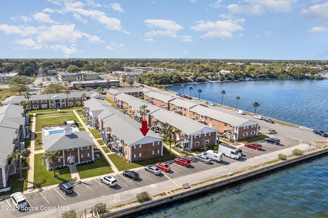 aerial view with a residential view and a water view