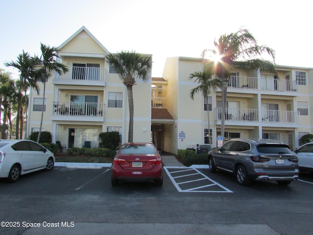 view of property with uncovered parking