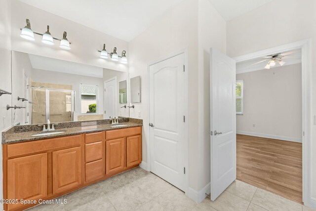 3980 Funston Cir, Melbourne, FL 32940 - full bath featuring a stall shower, a wealth of natural light, a ceiling fan, and a sink