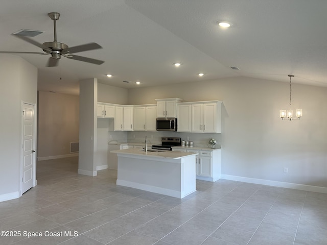 kitchen with visible vents, ceiling fan with notable chandelier, a sink, stainless steel appliances, and light countertops