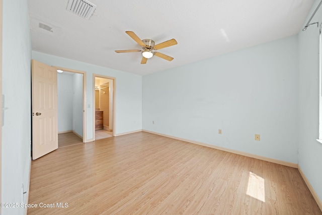 unfurnished bedroom with light wood-type flooring, visible vents, baseboards, and ceiling fan