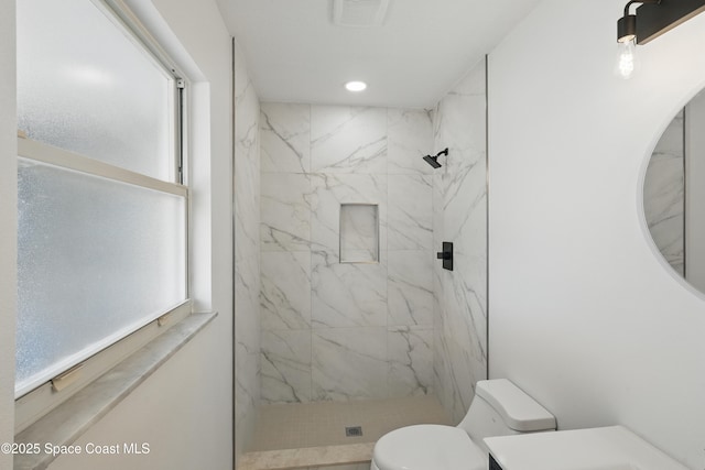 full bathroom with a marble finish shower, visible vents, toilet, and recessed lighting