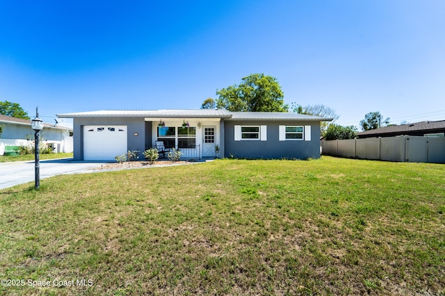 ranch-style house with fence, driveway, a front lawn, a garage, and metal roof