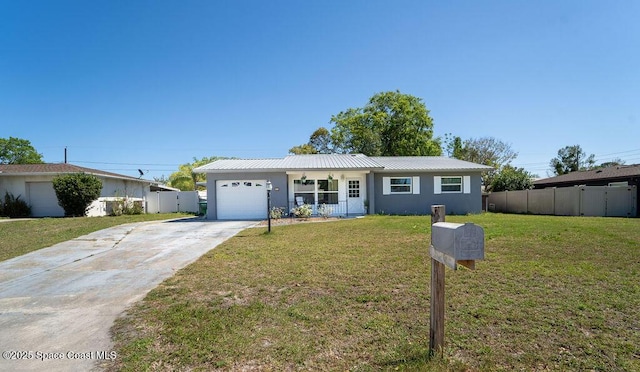 single story home featuring concrete driveway, fence, a garage, and metal roof