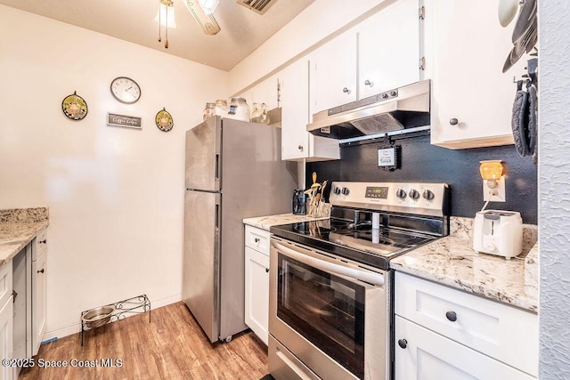 kitchen featuring under cabinet range hood, light wood-style flooring, appliances with stainless steel finishes, and white cabinetry