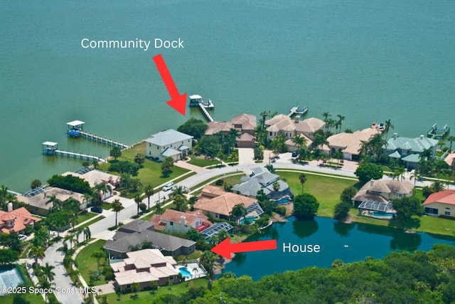 aerial view featuring a residential view and a water view