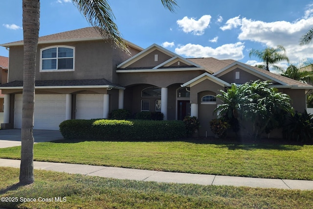 view of front of property with a front lawn, concrete driveway, roof with shingles, stucco siding, and a garage