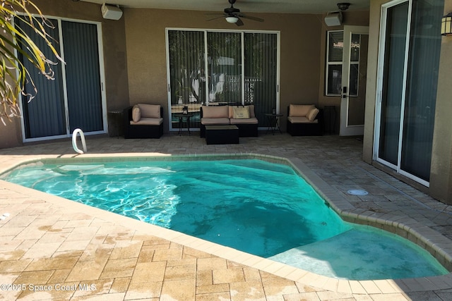 pool featuring a patio area, outdoor lounge area, and a ceiling fan