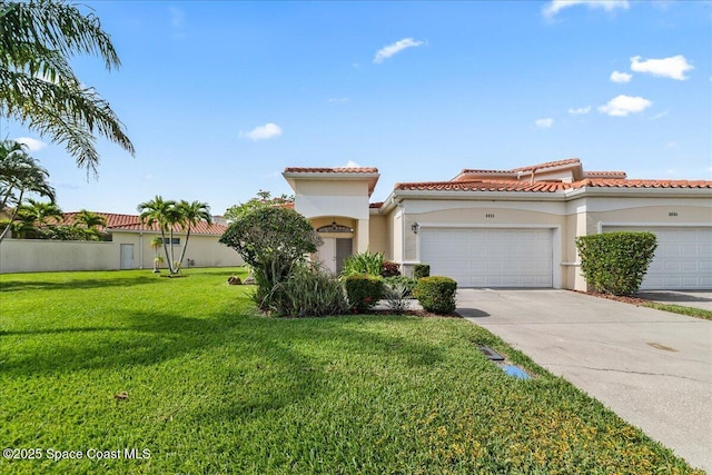 8652 Villanova Dr Unit 1001, Cape Canaveral, FL 32920 - mediterranean / spanish house featuring stucco siding, an attached garage, driveway, a front yard, and a tile roof