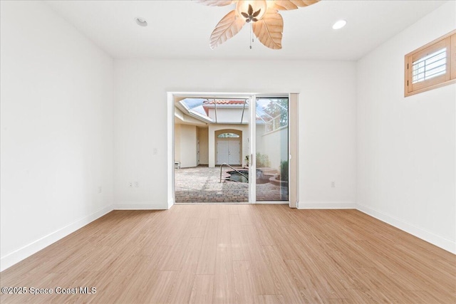 8652 Villanova Dr Unit 1001, Cape Canaveral, FL 32920 - spare room featuring ceiling fan, wood finished floors, baseboards, and recessed lighting
