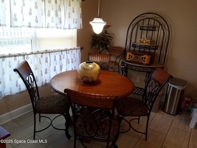 dining area with tile patterned floors and baseboards