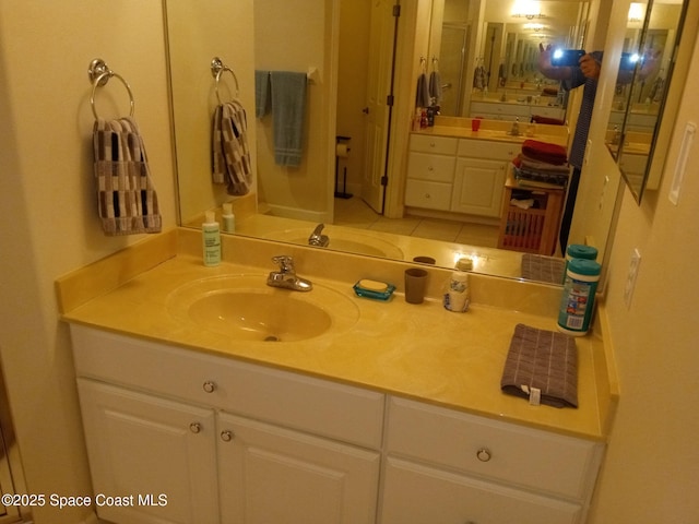 bathroom featuring tile patterned floors and vanity