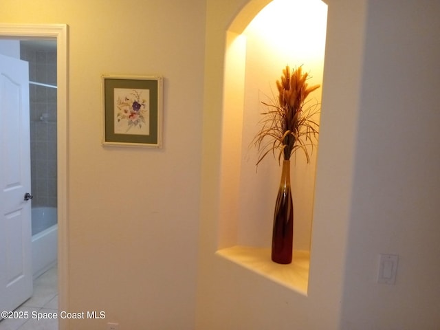 corridor with tile patterned flooring