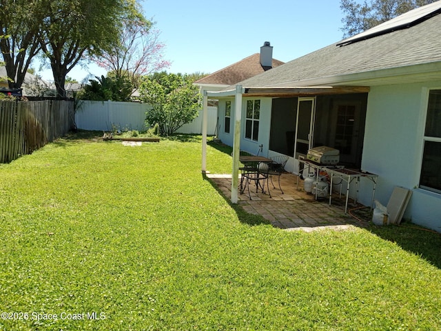 view of yard with a patio area and a fenced backyard