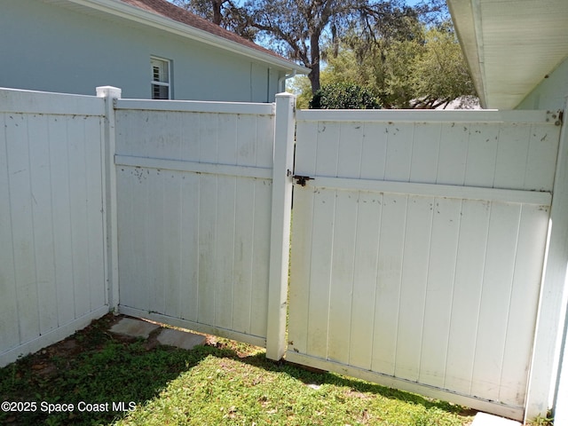 view of gate featuring fence