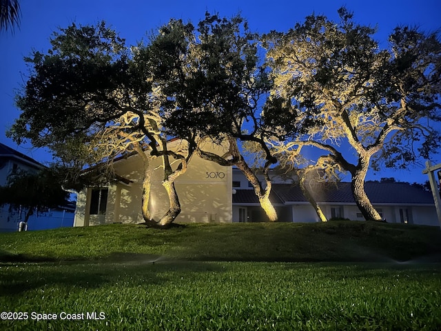 3070 Rio Plumosa N, Indialantic, FL 32903 - view of home's exterior with a yard