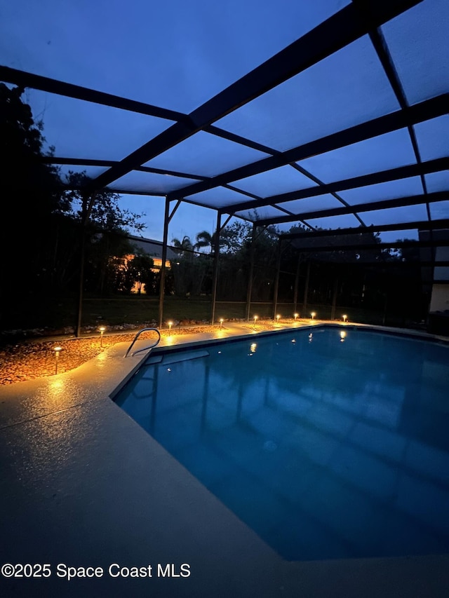 3070 Rio Plumosa N, Indialantic, FL 32903 - swimming pool with glass enclosure and a patio