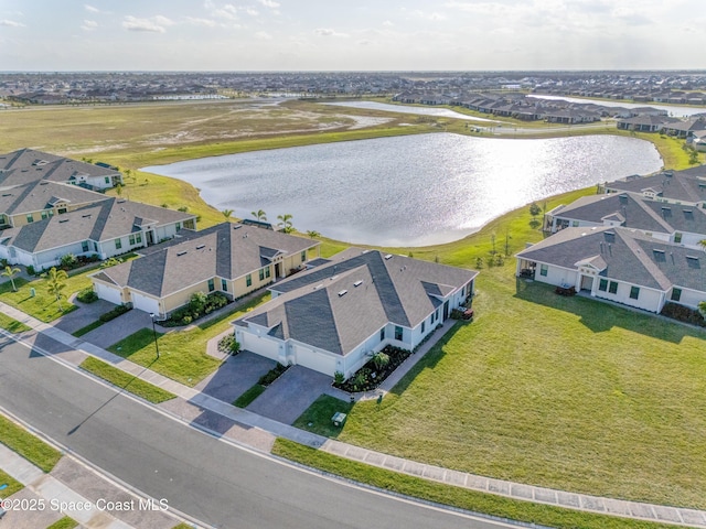 aerial view with a residential view and a water view