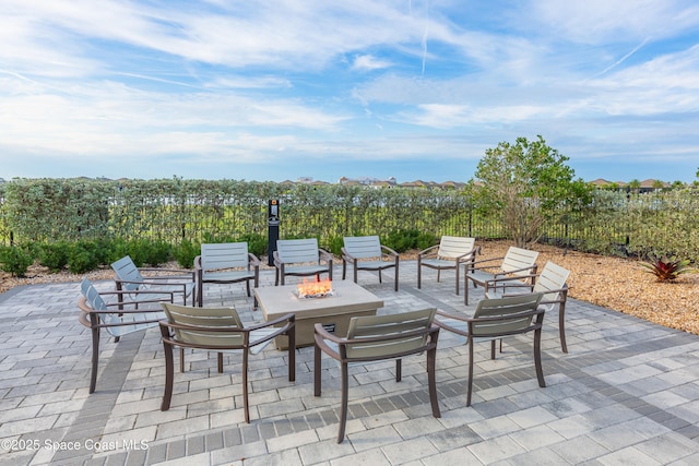 view of patio with an outdoor fire pit