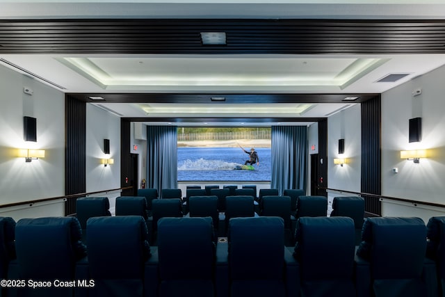home theater room with a tray ceiling