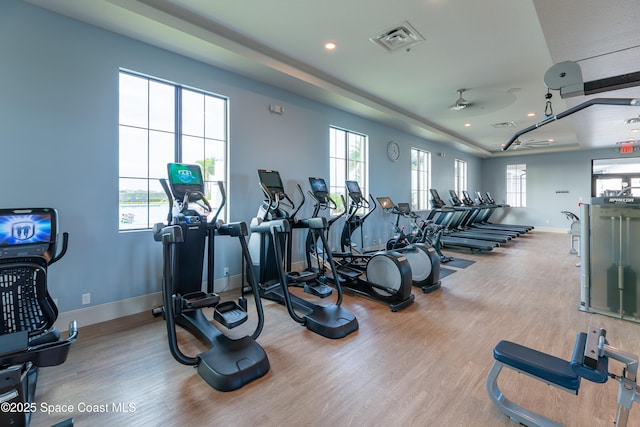 gym featuring recessed lighting, wood finished floors, visible vents, and baseboards