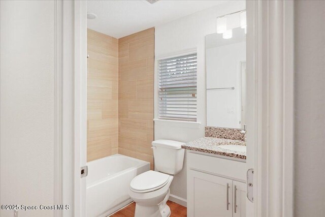 bathroom with shower / washtub combination, toilet, vanity, and wood finished floors