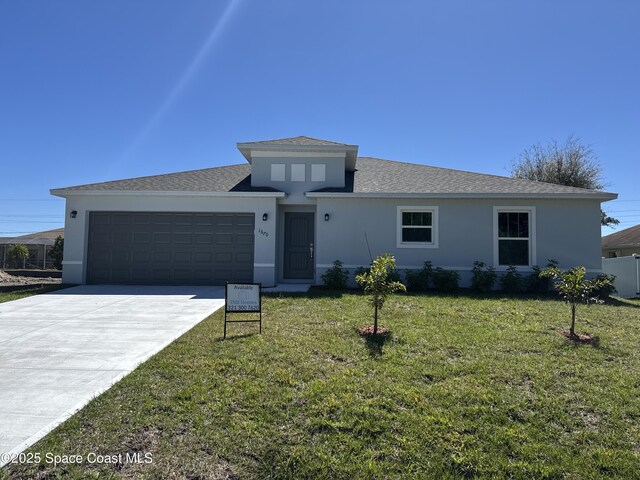 view of front of property featuring a front lawn, an attached garage, driveway, and stucco siding