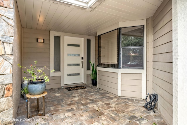 view of exterior entry with stone siding