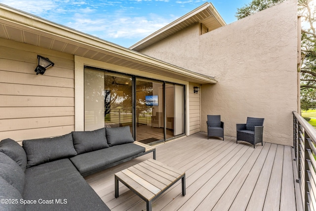 wooden terrace featuring outdoor lounge area