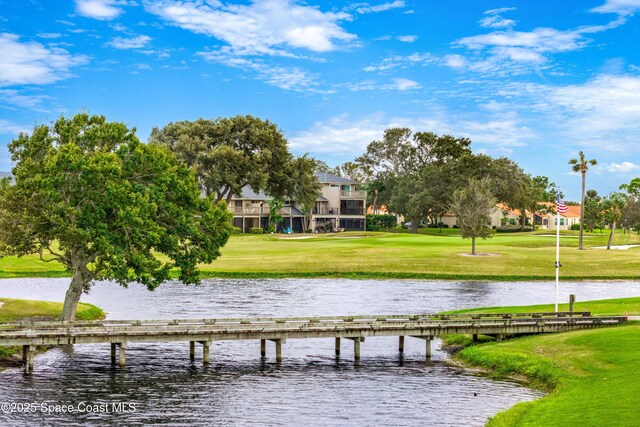 exterior space featuring a yard and a water view