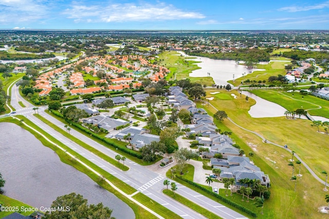 aerial view featuring a residential view, view of golf course, and a water view