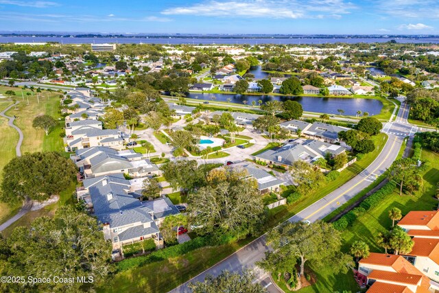 birds eye view of property featuring a residential view and a water view