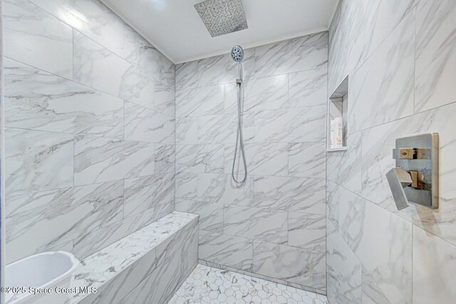 full bath with tiled shower
