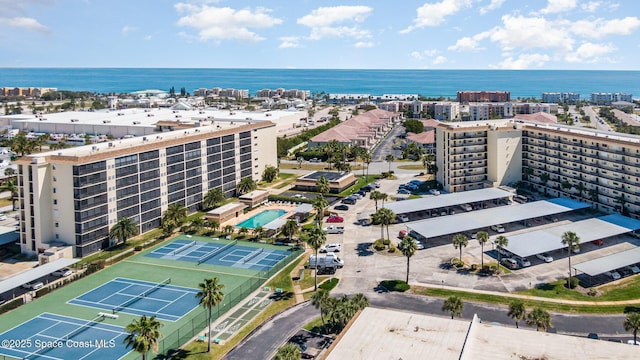 drone / aerial view featuring a city view and a water view