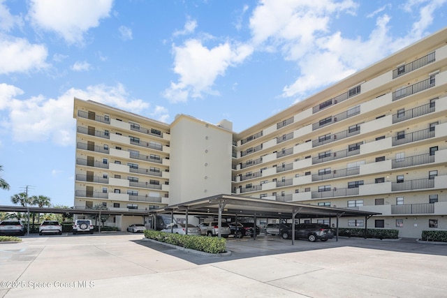 view of property featuring covered parking