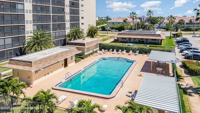 pool featuring a patio and fence