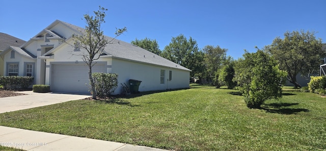 view of property exterior featuring a lawn, a garage, driveway, and stucco siding
