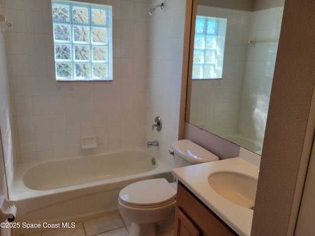 full bath with tile patterned floors, toilet, washtub / shower combination, and vanity