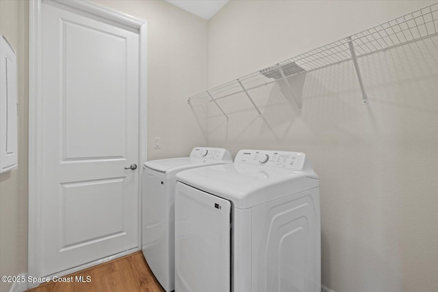 403 Fonsica St, Palm Bay, FL 32908 - laundry room with independent washer and dryer and light wood-type flooring