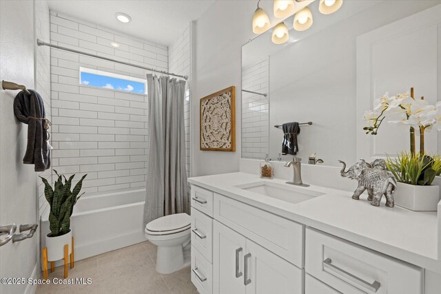 403 Fonsica St, Palm Bay, FL 32908 - bathroom with vanity, shower / tub combo with curtain, toilet, and tile patterned floors