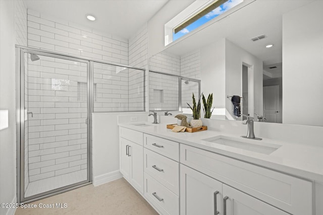 403 Fonsica St, Palm Bay, FL 32908 - bathroom with double vanity, a shower stall, and recessed lighting