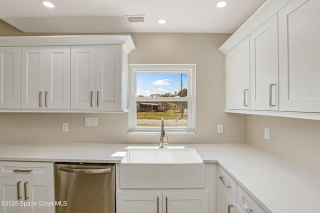 kitchen with white cabinets, visible vents, light countertops, a sink, and stainless steel dishwasher