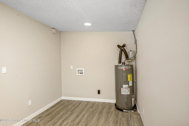utility room featuring water heater