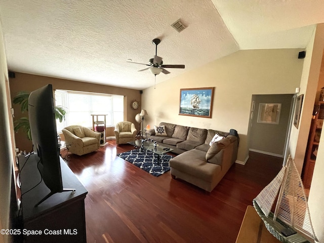 1961 Bradway St NE, Palm Bay, FL 32905 - living room featuring a ceiling fan, wood finished floors, baseboards, vaulted ceiling, and a textured ceiling