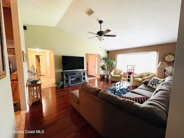 1961 Bradway St NE, Palm Bay, FL 32905 - living area with lofted ceiling, a ceiling fan, and wood finished floors