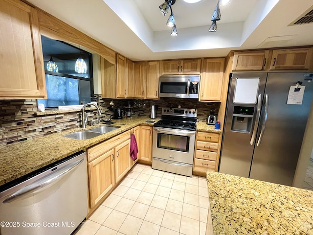 1961 Bradway St NE, Palm Bay, FL 32905 - kitchen with appliances with stainless steel finishes, a sink, light tile patterned flooring, tasteful backsplash, and light stone countertops