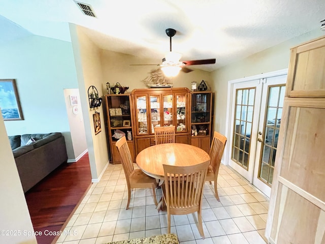 1961 Bradway St NE, Palm Bay, FL 32905 - dining space with french doors, a ceiling fan, light tile patterned floors, and baseboards