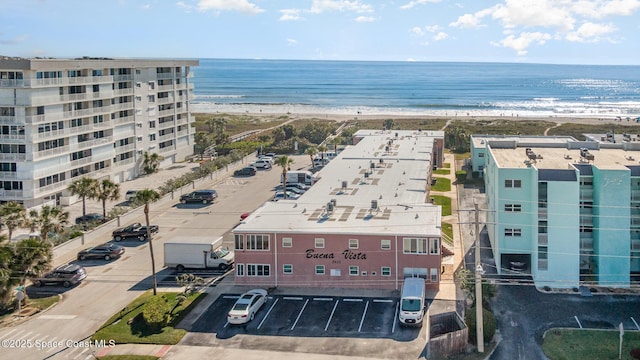 drone / aerial view with a view of the beach and a water view